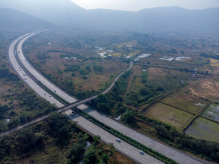 Aerial footage of the Mumbai-Pune Expressway near Pune India. The Expressway is officially called...