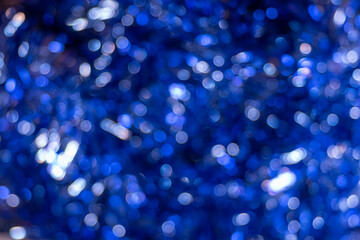 Blue shiny festive background. Beautiful background of defocused shiny blue round circles, festive bokeh