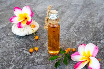 natural herbal oils extract flowers frangipani aroma therary local of asia arrangement flat lay style on background wooden