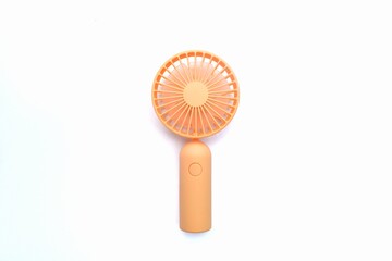 orange portable mini fan isolated on white © Afi
