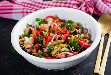 Salad  baked eggplant and fresh tomatoes. Warm eggplant salad.