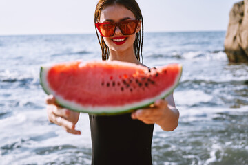 cheerful pretty woman in black swimsuit watermelon fashion travel