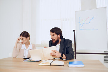 work colleagues In the office at the desk emotions