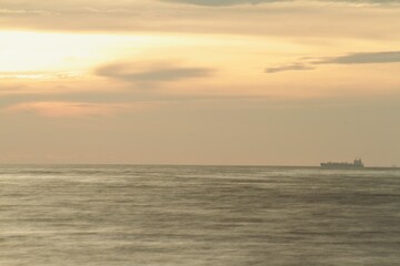 horizon from the seashore during golden hour in the evening