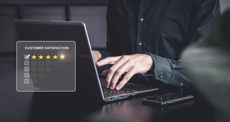 Business men is typing a costumer satisfaction on his smartphone