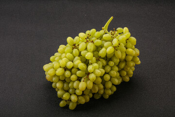 Green grape branch over background