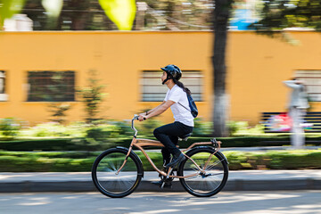 Man riding her bicycle on the street