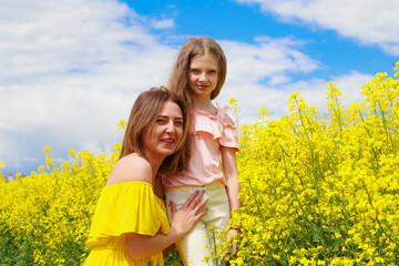 Mom and daughter in nature outdoors lifestyle. Communication pleasure concept.