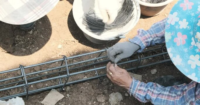 Labour working on steel ground beam building site construction building