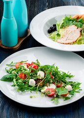 two salads of fresh vegetables on the table