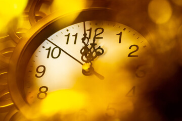 The clock in a gold frame shows the approach of the new year, 12 or 24 hours. New Year's greeting card