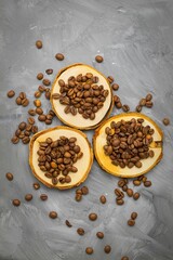 Roasted Arabica coffee beans are placed on three small wooden stands