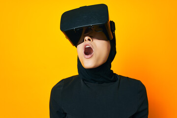 pretty woman in black hijab VR glasses emotions isolated background