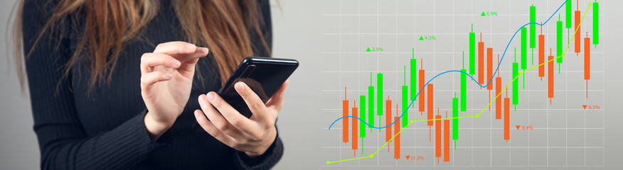 Double exposure of forex chart sketch hologram and woman holding mobile device