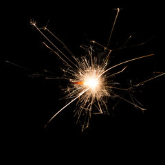 a sparkler on black background