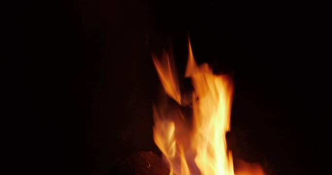 Burning tongues of fire on a black background