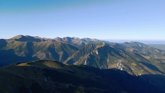 Flying around the rounded peak of Ciemniak, with a far-reaching views over the Tatra Mountains in Autumn.