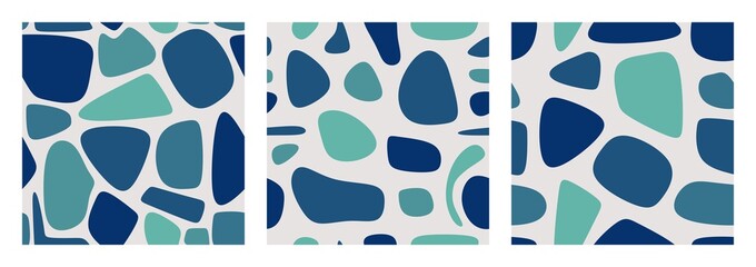 Set of three seamless patterns with abstract stains in blue colors.