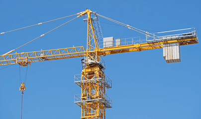 construction crane at blue sky background © AVD