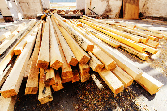 Wooden blocks at a construction site. Lumber for various structures and structures. Foreground