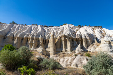 Amazing volcanic rock formations known as Love Valley in Cappadocia, Turkey. View from canyon to rocks with rooms inside.
