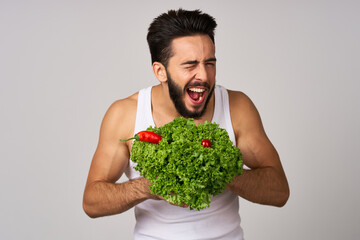 bearded man in white t-shirt lettuce leaf vegetables healthy food