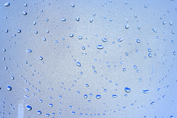 drops glass blue background abstract, transparent cold background water splashes