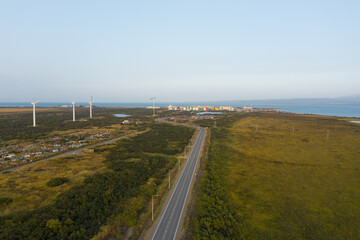 Windmills, road, city on the ocean Ust-Kamchatsk, Kamchtka