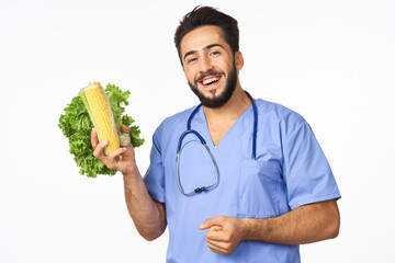 male nutritionist with vegetables in the hands of health calories