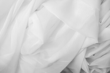 White fabric texture background. White tulle drapery.
