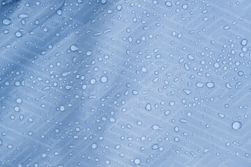 Naklejka na ściany i meble Water drops on water repellent fabric