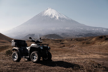 ATV Quad bike on volcano background. Klyuchevskaya Sopka, Kamchatka, off-road trip