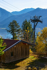 Cable car post in the mountain.
Lift post in the Alps with the sight to Schliersee lake, Bavaria, Germany