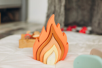 Eco friendly, plastic free toys for toddler. Stylish wooden toy for child on wooden table. Modern wooden colorful toys. Space for text