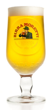 Glass of Moretti pilsener beer isolated on white