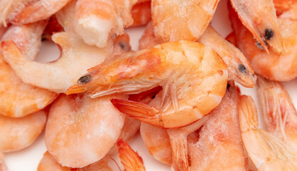Red frozen shrimp as background.