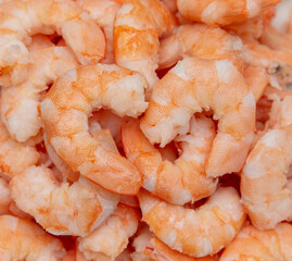 Peeled red shrimp meat as background.