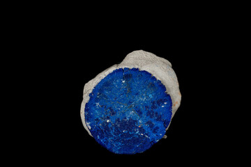 Macro mineral stone Azurite in siltstone against black background