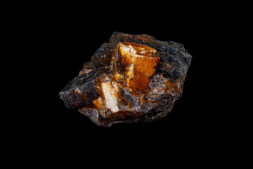 Macro of the mineral stone Columbite, Beryl, Feldspar on a black background