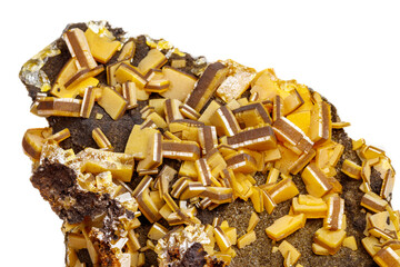 Macro mineral stone yellow Wulfenite on a white background