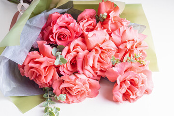 Delicate bouquet for woman made of  pink openwork roses. Trendy bouquet
