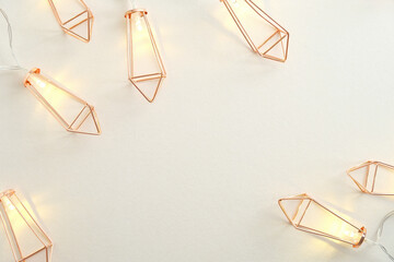 Modern Christmas Light Garland on white background. Flat lay, top view, copy space.