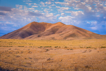 Breathtaking view of the orange hills and yellow field. Amazing landscape in Idaho. USA