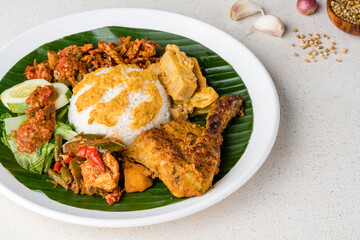 Nasi Padang with  chicken rendang  is an Indonesian food from West Sumatra in Indonesia.
Nasi Padang Chicken Roast as favorites food for Indonesian people.