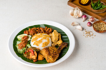 Nasi Padang with  chicken rendang  is an Indonesian food from West Sumatra in Indonesia.
Nasi Padang Chicken Roast as favorites food for Indonesian people.