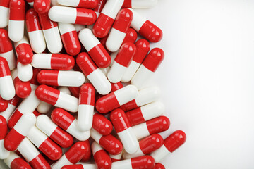 Red and white tablets on a white background with free space.