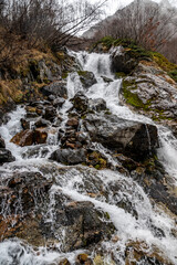 travel, walk, autumn, october, cloudy day, nature, landscape, mountain gorge, valley, mountains, snowy peaks, vegetation, trees, rocks, fog, waterfall, streams, water