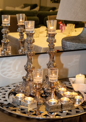 Fototapeta na wymiar Candles lit to celebrate the Jewish Sabbath on Friday night, erev Shabbat, according to tradition.