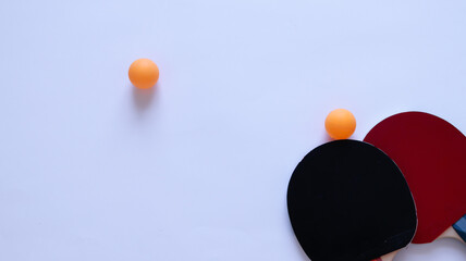 ping pong paddles with balls on white background