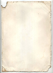 Vintage paper with folds, dark shabby edges, with spots and torn corners.
